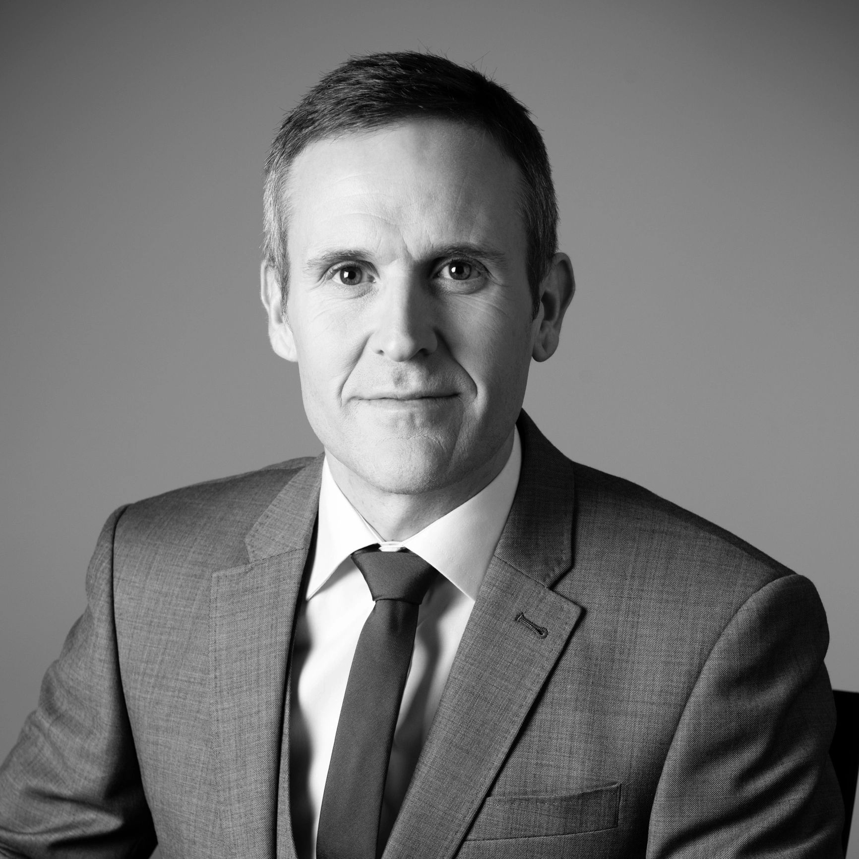 Professional headshot of a male attorney